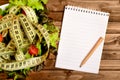 Empty notepad with vegetable salad Royalty Free Stock Photo