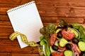 Empty notepad with vegetable salad Royalty Free Stock Photo
