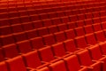 Empty oditorium with red cinema or theatre seats, chairs.