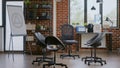 Empty office with aa meeting sign on white board and chairs in circle Royalty Free Stock Photo