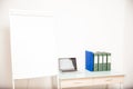 Empty office with a blank flip chart Royalty Free Stock Photo