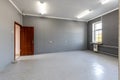 Empty Office Room with Grey Walls and Bright Windows Royalty Free Stock Photo