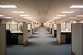 empty office with rows of unoccupied cubicles