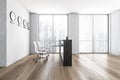 Empty office  white reception at white wall  four clocks on it. Panoramic window with city view. Concept of reception. 3D Royalty Free Stock Photo