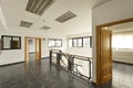 Empty offices with gray stoneware floors, metal railing, wood Royalty Free Stock Photo