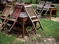 Empty old abandoned wooden dining table set on the green yard garden. Royalty Free Stock Photo