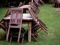 Empty old abandoned wooden dining table set on the green yard garden. Royalty Free Stock Photo