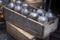 The Empty old bottles in a wooden box at the market. Can be used to decorate an apartment Royalty Free Stock Photo