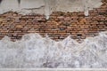 Empty Old Brick Wall Texture. walls disintegration see red brick. Building Facade With Damaged Plaster Royalty Free Stock Photo