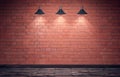 Empty old grungy room with red brick wall and wooden floor