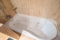 Empty and old jacuzzi bath tube in bathroom interior of a flat Royalty Free Stock Photo