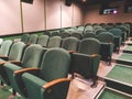 Empty old movie theater. Green armchairs. Waiting for visitors. Royalty Free Stock Photo