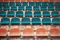 Empty old plastic seats at stadium, open door sports arena.