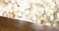 Empty old rustic angle wood table top with blur sparkling gold bokeh abstract background,panoramic banner for display or montage