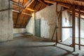 Empty old rustic attic with door.