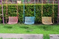 Empty old swing in playground garden background Royalty Free Stock Photo