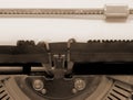 Empty by the old typewriter on white paper with sepia toned Royalty Free Stock Photo