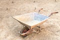Empty one wheel construction cart prepared in the construction b Royalty Free Stock Photo