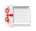 Empty open gift box with red color bow knot and ribbon isolated on white background. Royalty Free Stock Photo