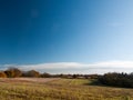 Empty open grass land farm land scene plain agriculture blue sky