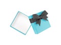 pastel blue gift box with black ribbon bow wrapped around lid isolated on white background Royalty Free Stock Photo