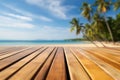 Empty orange bamboo table top stands for display product against the defocused white sand beach surrounded with coconut trees and Royalty Free Stock Photo