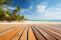 Empty orange bamboo table top stands for display product against the defocused white sand beach surrounded with coconut trees and Royalty Free Stock Photo