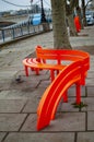 Empty orange bench on river thames london on south bank