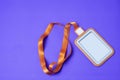 Empty orange employee card With strap placed on a purple background make it look clear For inserting messages or ideas Royalty Free Stock Photo