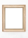 Empty ornate picture frame hanging on wall