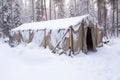empty outdoor emergency shelter in snowy backcountry