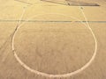 Empty outdoor handball playground, plastic hairy green surface on ground and white blue bounds lines. Royalty Free Stock Photo