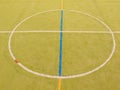 Empty outdoor handball playground, plastic light green surface on ground. Empty gate. Royalty Free Stock Photo