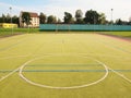 Empty outdoor handball playground, plastic light green surface on ground. Empty gate. Royalty Free Stock Photo