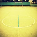 Empty outdoor handball playground, plastic light green surface on ground and white blue bounds lines. Royalty Free Stock Photo