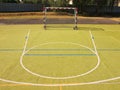 Empty outdoor handball playground, plastic light green surface on ground and white blue lines. Royalty Free Stock Photo