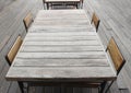 Empty outdoor old vintage wood table and chair in coffee shop restaurant Royalty Free Stock Photo