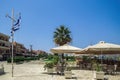 Empty outdoor seafront cafes with chairs and tables at summer in Lixouri Town on the Ionian Island of Cephalonia Greece