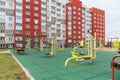 An empty outdoor sports ground with outdoor exercise equipment and modern rubber coating. Metal vandal-proof sports equipment in