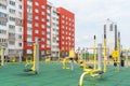 An empty outdoor sports ground with outdoor exercise equipment and modern rubber coating. Metal vandal-proof sports equipment in