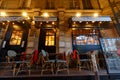 Empty outdoor terrace of Parisian cafe Germaine in Paris city centre on a cloudy winter morning