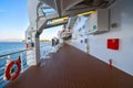 The empty outer deck of a cruise ship with no identifiable features cruising the Aegean Sea on a summer day