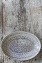 Empty Oval Dish over Rustic Timber Top View
