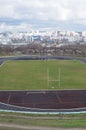 Empty oval sports stadium with running tracks and football field Royalty Free Stock Photo