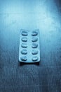 pack of pills on a blue retro table Royalty Free Stock Photo