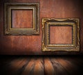 Empty painting frames on rusted wall