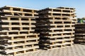 Empty pallets at a construction site. Reuse of wooden pallets in construction