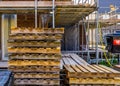 Empty pallets with scaffolding in the background, construction site in Rucphen, The Netherlands, 6 may, 2022