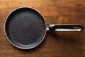 Empty pan for pancake on wood background Royalty Free Stock Photo