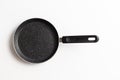 Empty pan on white background. Fried pan with spatula Royalty Free Stock Photo